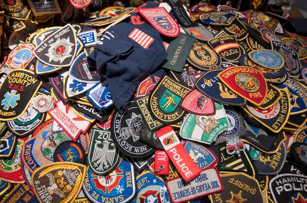 Police and fireman badges. 9 11 Memorial Inside ST PAULS CHAPEL NEW YORK CITY. Pictures that remind happened in the attack of September 11, 2001 in the chapel inside St. Paul s Chapel. 209-211 Broadway. Telephone 212-233-4164. (Mon-Sat 10am - 6pm Sat 7am - 6pm; classical concerts Mon 13:00). A miracle saved this Georgian chapel on the fateful attack on 11-S, as it is located a few meters from the eastern part of the World Trade Center. Inside still recall those days with photographs, drawings of children who lost their parents and objects donated items during those days to help rescue teams who worked there. According to legend, this chapel became an oasis in the middle of hell. Before the attack, tourists were coming up here to see the bank where George Washington came to pray, which is still preserved. New York New York State USA Copyright: xSergixReboredox SRE-BS0667