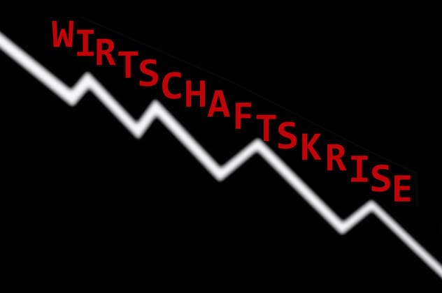 Stock market price and economic crisis Stock market price and economic crisis, 13 03 2020, Borkwalde, Brandenburg, Germany, The words economic crisis are written on a sloping stock market curve