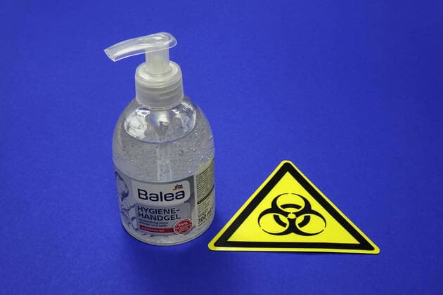 Hygiene hand gel and symbol of Biohazard Hygiene hand gel and symbol of Biohazard, 12 03 2020, Borkwalde, Brandenburg, Next to a bottle of Hygiene hand gel is the symbol of Biohazard