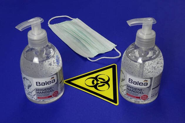 Hygiene hand gel and symbol of Biohazard Hygiene hand gel and symbol of Biohazard, 12 03 2020, Borkwalde, Brandenburg, Next to two bottles of hygiene hand gel is the symbol of Biohazard