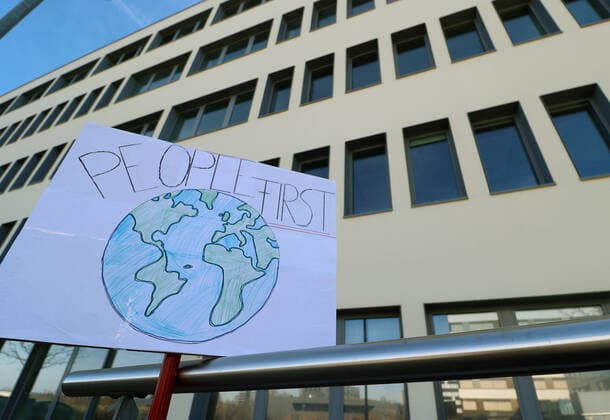 Tuebingen 15 03 2020 Protest poster People first in front of the headquarters of the biopharmaceutical company with CureVac AG in Tuebingen US President Donald Trump wants to secure the Tuebingen corona vaccine development for the USA ULMER