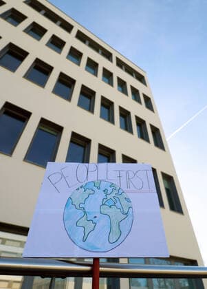 Tuebingen 15 03 2020 Protest poster People first in front of the headquarters of the biopharmaceutical company with CureVac AG in Tuebingen US President Donald Trump wants to secure the Tuebingen corona vaccine development for the USA ULMER