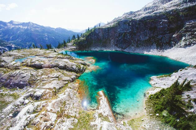 High angle view of aquamarine alpine lake in high mountains. Vancouver, BC, Canada CR_JDIP200213-303914-01