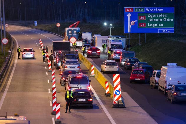 March 15, 2020, Jedrzychowice, Poland: Policemen inspect vehicles during the sanitary control on the A4 route at the Jedrzychowice border crossing..Poland has declared a state of epidemic emergency and will temporarily close its borders to non-citizens as it ramps up efforts to curb the spread of the coronavirus. Jedrzychowice Poland - ZUMAs197 20200315_zaa_s197_121 Copyright: xKarolxSerewisx