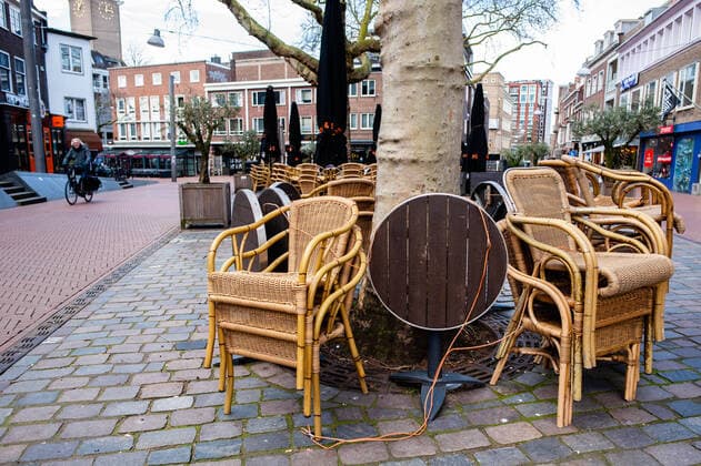 March 16, 2020, Nijmegen, Netherlands: A view of chairs and tablets collected from one of the closed restaurants..The Dutch cabinet announced another set of drastic measures in a press conference by Minister Slob (education) and Bruins (healthcare). All food and beverage outlets in the Netherlands closed yesterday from 6 pm and remain closed until 6 April. But still, in some cities like Nijmegen, people keep taking the streets to go for a walk or to visit the flea market without use a distance of about 1.5 meters as a guideline, while all restaurants, bars, and pubs are closed. Nijmegen Netherlands - ZUMAs197 20200316_zaa_s197_120 Copyright: xAnaxFernandezx