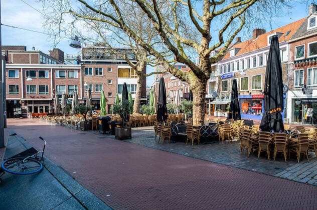 March 16, 2020, Nijmegen, Netherlands: A view of a square with all the restaurants closed..The Dutch cabinet announced another set of drastic measures in a press conference by Minister Slob (education) and Bruins (healthcare). All food and beverage outlets in the Netherlands closed yesterday from 6 pm and remain closed until 6 April. But still, in some cities like Nijmegen, people keep taking the streets to go for a walk or to visit the flea market without use a distance of about 1.5 meters as a guideline, while all restaurants, bars, and pubs are closed. Nijmegen Netherlands - ZUMAs197 20200316_zaa_s197_128 Copyright: xAnaxFernandezx