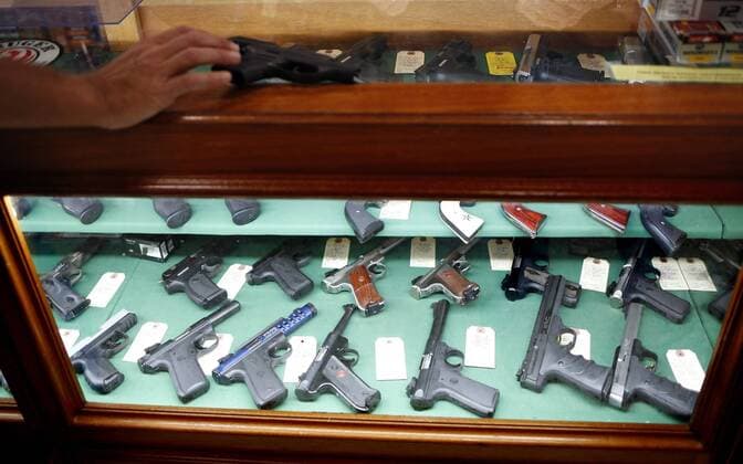 December 8, 2015, Pinellas Park, Florida, USA: Alan McFadden, 54, of Seminole, looks at guns and shops for ammunition in the gun shop at Bill Jackson s Shop For Adventure Tuesday, Dec. 8, 2015. Pinellas Park USA - ZUMAs70_ 20151208_zan_s70_033 Copyright: xLaraxCerrix