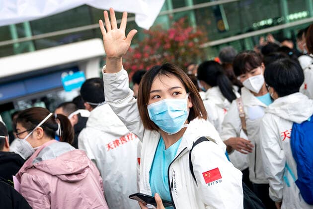 (200317) -- WUHAN, March 17, 2020 -- A medical staffer from north China s Tianjin Municipality waves goodbye at Wuhan Tianhe International Airport in Wuhan, central China s Hubei Province, on March 17, 2020. Some medical assistance teams started leaving Hubei Province on Tuesday as the epidemic outbreak in the hard-hit province has been subdued. ) CHINA-WUHAN-COVID-19-MEDICS-DEPARTURE (CN) XiongxQi 