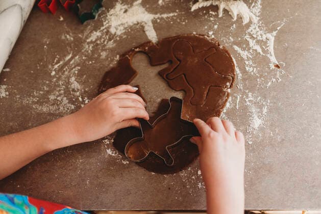 Close up of Child s Hands Making Gingerbread Men Cookies Hillsdale, MI, United States CR_OMHX200220-268395-01