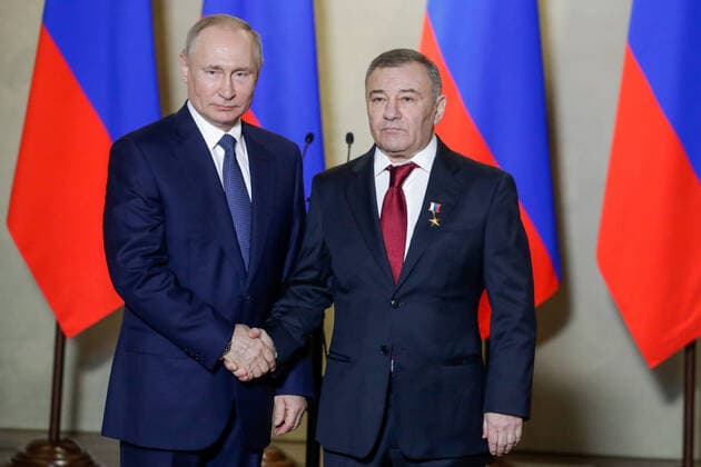 SEVASTOPOL, RUSSIA - MARCH 18, 2020: Russia s President Vladimir Putin (L) awards a Russian Hero of Labour gold star to Stroygazmontazh owner Arkady Rotenberg for the construction of Kerch Strait Bridge, during a ceremony at the Konstantinovskaya Batareya Konstantin Battery Museum and Exhibition Centre. Mikhail Metzel TASS  TS0D2A26