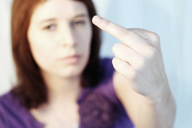 Middle finger Shot of young woman showing middle finger  Copyright: xfahrnerx 1238408