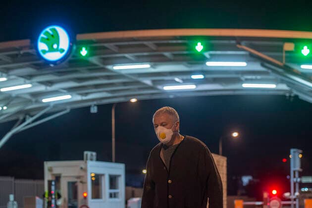 An employee of Czech car-maker Skoda Auto leaves Skoda Auto s plant in Mlada Boleslav, Czech Republic, after shutdown of the plant in relation to coronavirus outbreak, on March 18, 2020. (CTKxPhoto RadekxPetrasek) CTKPhotoP202003181238301 PER 15