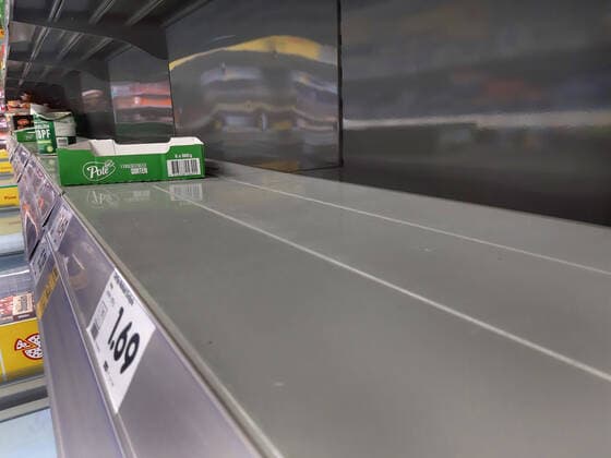 Shopping in a supermarket in Duesseldorf Empty shelf without preserves Shopping