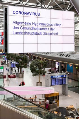 Düsseldorf Airport unusually empty due to the corona crisis, large displays with general hygiene regulations for prevention