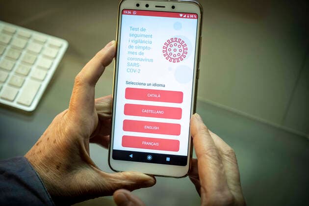 March 19, 2020, Barcelona, Catalonia, Spain: In this photo illustration a mobile phone displaying the SARS-COV-2 symptom tracking mobile app..The Health Department of the Generalitat of Catalunya has made available to citizens an app for monitoring and surveillance of the symptoms of the SARS-COV-2 coronavirus. Barcelona Spain - ZUMAs197 20200319_zaa_s197_163 Copyright: xPacoxFreirex