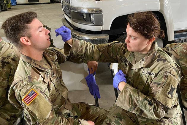 March 18, 2020, Lansing, Michigan, USA: Medics with the Louisiana Army and Air National Guard conduct training with the Department of Health and Human Services to ensure proper protection and administering of drive thru testing, March 18, 2020 in New Orleans Lansing United States - ZUMAz03_ 20200318_sha_z03_822 Copyright: xU.S.xNationalxGuardx