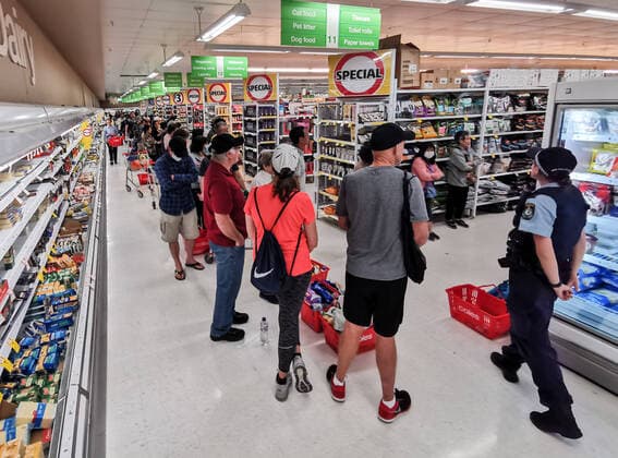 COLES EPPING TOILET PAPER QUEUE, A Police Officer watches on at people queueing for a delivery of toilet paper, paper towel and pasta at Coles Supermarket, Epping in Sydney, Friday, March 20, 2020. Supermarkets have been struggling to keep up with demand for products such as toilet paper in recent days, as panic buying as a result of the Covid-19 pandemic has resulted in people purchasing far more than usual. Supermarkets have put in place limits on the quantity people can purchase of many everyday items. ( NO ARCHIVING, EDITORIAL USE ONLY, NO USE IN BOOKS WITHOUT CONSENT SYDNEY NSW AUSTRALIA  Copyright: xJAMESxGOURLEYx 20200320001458258869