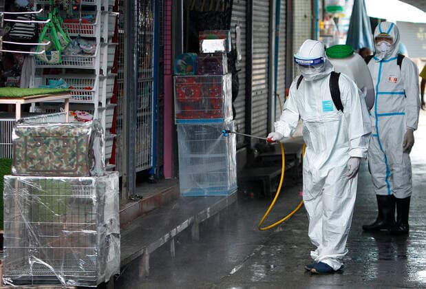 March 20, 2020, Bangkok, Thailand: Thai officials spray disinfectant at Pet market during a precaution against the coronavirus Covid-19 outbreak in Bangkok on March 20, 2020. Total number of deaths stemming from the growing pandemic at 10,030. The number of people infected worldwide is nearing 245,000 with most cases in China, followed by Italy and Iran, according to its data. Bangkok Thailand - ZUMAu103 20200320_zia_u103_001 Copyright: xUrdeexImagex