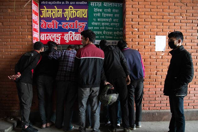 March 28, 2020, Kathmandu, Nepal: People gather at a ticket counter to buy bus tickets amid Coronavirus threats..Nepalese government decided to close down public places such as schools, movie theatres, night clubs, Health clubs, cultural centres and Sports zone, from 19 March to 30 April 2020 as part of precautionary measures against the spread of the corona virus Covid-19. Kathmandu Nepal - ZUMAs197 20200328_zaa_s197_002 Copyright: xPrabinxRanabhatx