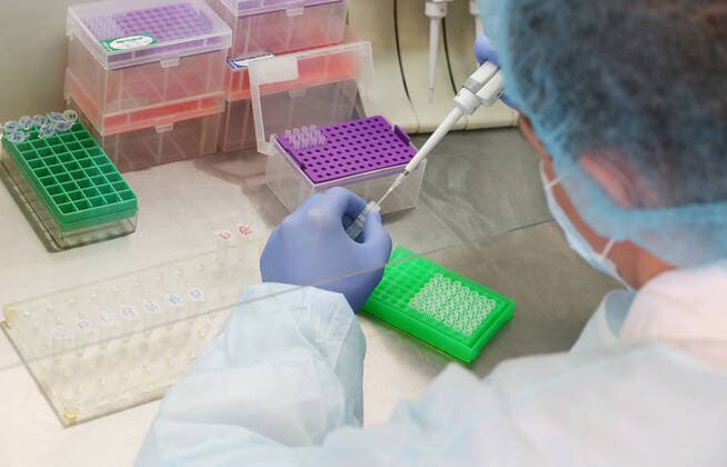 ULYANOVSK, RUSSIA - MARCH 20, 2020: An employee working on a polymerase chain reaction at the TestGene company developing and manufacturing molecular genetics test kits. Yegor Aleyev TASS  TS0D2E21