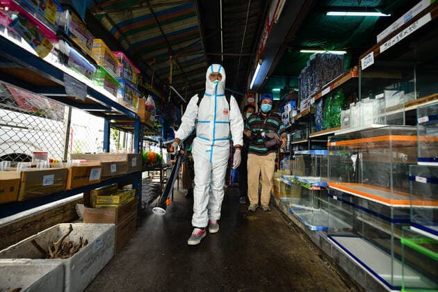 March 20, 2020, Bangkok, Thailand: A worker dressed in a protective suite sprays disinfectants as a preventive measure against the spread of Coronavirus at the Chatuchak Weekend Market in Bangkok..Thailand has so far reported 322 cases of COVID-19 coronavirus with most of the cases reported in the Capital city of Bangkok. Bangkok Thailand - ZUMAs197 20200320_zaa_s197_025 Copyright: xAmpholxThongmueangluangx