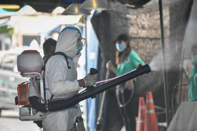 March 20, 2020, Bangkok, Thailand: A worker dressed in a protective suite sprays disinfectants as a preventive measure against the spread of Coronavirus at the Chatuchak Weekend Market in Bangkok..Thailand has so far reported 322 cases of COVID-19 coronavirus with most of the cases reported in the Capital city of Bangkok. Bangkok Thailand - ZUMAs197 20200320_zaa_s197_033 Copyright: xAmpholxThongmueangluangx