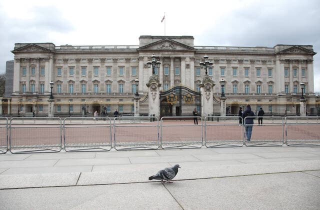 Queen Elizabeth II, has left Buckingham Place to go to Windsor, and there are very few people and a solitary pigeon wandering about at lunchtime. The COVID-19 Coronavirus crisis continues, and although there is no lockdown in London, some changes to public transport have been made as there seems to be fewer people and tourists moving around the city. COVID-19 Coronavirus crisis, London, UK on March 20, 2020 