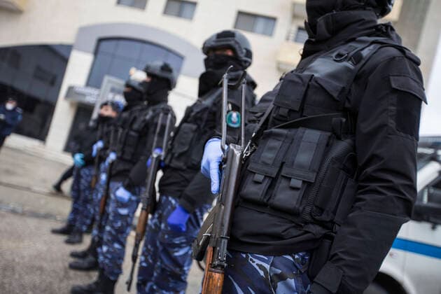 March 20, 2020, Bethlehem, West Bank: Palestinian policemen in front of Paradise Hotel during the release of quaranined employees inside. Bethlehem West Bank - ZUMAb133 20200320_zap_b133_025 Copyright: xMustafaxBaderx