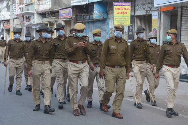 India: Curfew after COVID-19 positive cases Rajasthan Police personnel conduct a flag march in Bhilwara. Government declared curfew in the city after six tested postive for COVID-19 to prevent further spread of the disease. Bhilwara Rajashan India Copyright: SumitxSaraswat