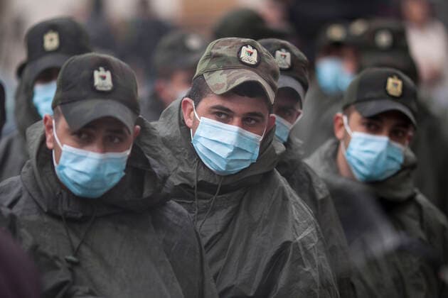 March 20, 2020, Beit Jala, West Bank: Palestinian Security Forces troops being sterilized after the end of quarantine at Angles Hotel. Beit Jala West Bank - ZUMAb133 20200320_zap_b133_042 Copyright: xMustafaxBaderx