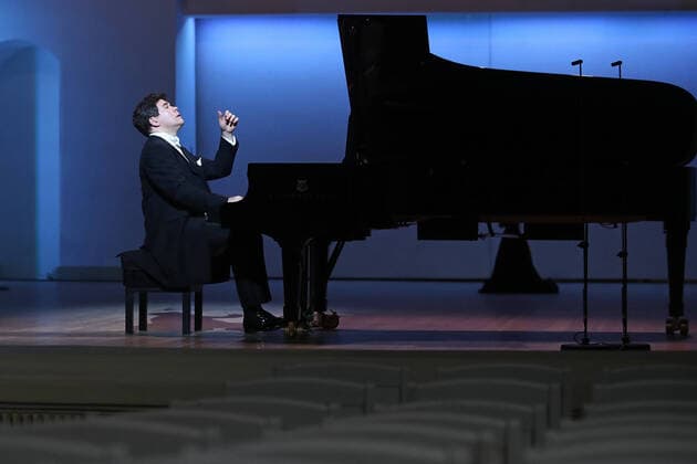 MOSCOW, RUSSIA - MARCH 20, 2020: Pianist Denis Matsuev performs during a live broadcast from the empty Tchaikovsky Concert Hall. The Russian Culture Ministry advised to suspend public events due to the COVID-19 coronavirus pandemic. Valery Sharifulin TASS  TS0D2E9D