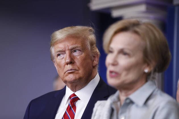 Deborah Birx, coronavirus response coordinator, speaks as U.S. President Donald Trump, left, listens during a Coronavirus Task Force news conference in the briefing room of the White House in Washington, DC on Friday, March 20, 2020. Americans will have to practice social distancing for at least several more weeks to mitigate U.S. cases of Covid-19, Anthony S. Fauci of the National Institutes of Health said today.  WAX20200320928 ALxDRAGO