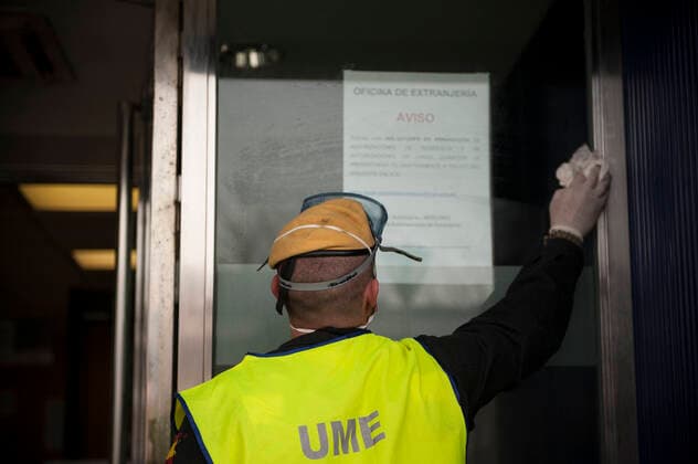 March 20, 2020, Pamplona, Navarra, Spain: Member of the Spanish Military Emergency Unit, carrying out disinfection tasks at the Pamplona Immigration Office..A total of four self-bomb trucks and 15 military personnel wearing protective equipment continue the disinfection work entrusted to the Spanish Military Emergency Unit by the Ministry of Interior, in areas that could have been infected with the coronavirus Pamplona Spain - ZUMAs197 20200320_zaa_s197_102 Copyright: xElsaxAxBravox