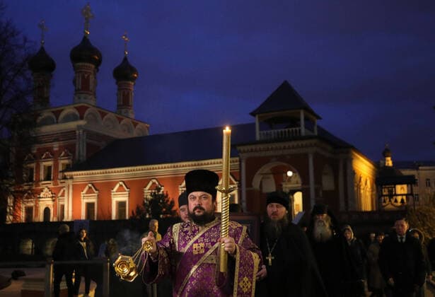 MOSCOW, RUSSIA - MARCH 20, 2020: Priests during a religious procession at the Vysokopetrovsky Monastery. Starting from March 18, monks conduct a religious procession and spray holy water after the evening service at the monastery amid the coronavirus pandemic. Sergei Bobylev TASS  TS0D2EDD