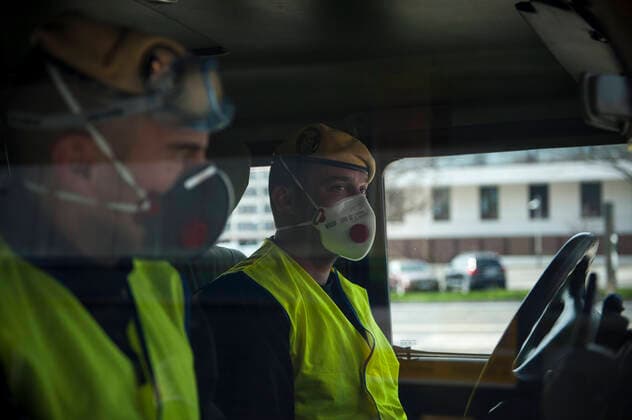 March 20, 2020, Pamplona, Navarra, Spain: Members of the Spanish Military Emergency Unit, wearing face masks as a preventive measure, during the disinfection tasks at the Pamplona Immigration Office..A total of four self-bomb trucks and 15 military personnel wearing protective equipment continue the disinfection work entrusted to the Spanish Military Emergency Unit by the Ministry of Interior, in areas that could have been infected with the coronavirus Pamplona Spain - ZUMAs197 20200320_zaa_s197_113 Copyright: xElsaxAxBravox