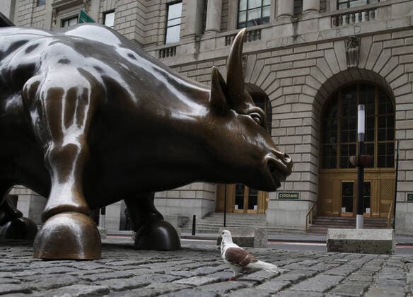 Almost no pedestrian traffic surrounds the Wall Street Statue of the Charging Bull on Broadway just north of Bowling Green after the opening bell on Wall Street in New York City on Friday, March 20, 2020. The New York Stock Exchange will close down the floor and will move temporarily to fully electronic trading on Monday, March 23 due to the Coronavirus pandemic.  NYP20200320156 JOHNxANGELILLO
