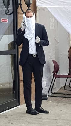 March 20, 2020, New York, New York, USA: Covid 19 New York City. Corona Virus walk in test center tent set up in Midwood section of Brooklyn. person waiting to be tested. he has a makeshift mask that he made out of a shirt. New York USA - ZUMAct2_ 20200320_zaf_ct2_021 Copyright: xBrucexCotlerx