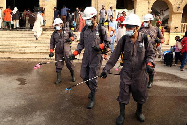 (200320) -- KARACHI (PAKISTAN), March 20, 2020 -- Workers disinfect a railway station in southern Pakistani port city of Karachi, on March 20, 2020. While ruling out a complete lockdown of the country, Pakistani Prime Minister Imran Khan Friday urged people to adopt social distancing as a precautionary measure to contain the spread of COVID-19. According to the federal government statistics, there were 457 confirmed cases of COVID-19 in Pakistan so far. (Str Xinhua) PAKISTAN-KARACHI-COVID-19-MEASURES Stringer 