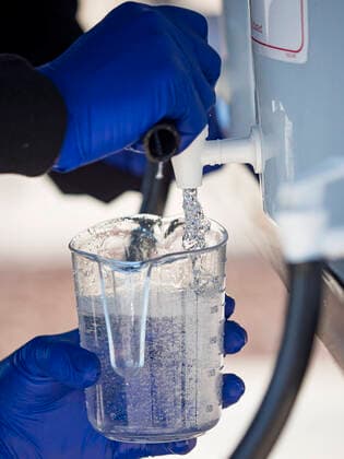 March 20, 2020, Des Moines, Iowa, U.S: Workers at the Foundry, a distillery in Des Moines, pour hand sanitizer into a bottle for a waiting motorist. The distillery suspended its distilling operations to make hand sanitizer this week. They distributed it free to people who came to their building. On Friday thousands of people came to get some. There line was more than one mile long. On Friday morning, 20 March, Iowa reported 45 confirmed cases of the Coronavirus. Restaurants, bars, movie theaters, places that draw crowds are closed for at least 30 days. There are no shelter in place orders in effect anywhere in Iowa but people are being encouraged to practice social distancing and many businesses are requiring or encouraging employees to telecommute. Des Moines U.S. - ZUMAk94_ 20200320_zaf_k94_019 Copyright: xJackxKurtzx