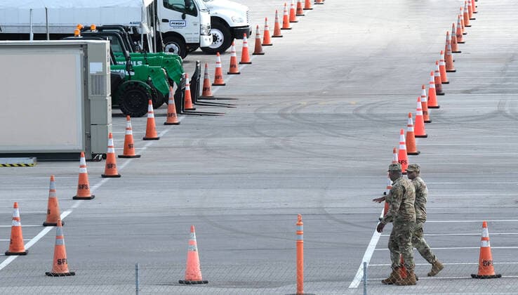 The Army Corps of Engineers set up a parking lot for Coronavirus testing and staging of the Florida National Guard at the Hard Rock Stadium on Friday, March 20, 2020 in Miami, Florida. This test site is scheduled to handle Miami area residents to help identify the Coronavirus Pandemic.  MIA20200320104 GARYxIxROTHSTEIN