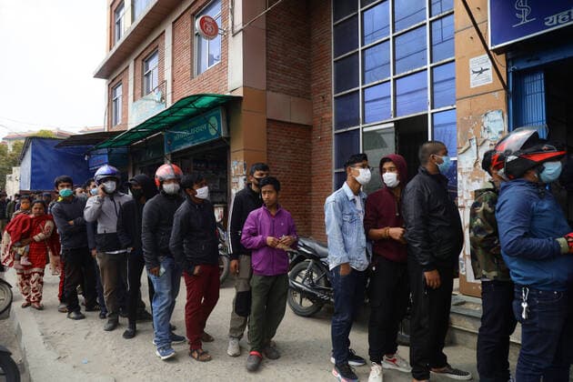 Impact of COVID-19 at Kathmandu Nepalese People standing queue to a buy face masks from the Sajha Shwashthya Sewa drug store run by the Government of Nepal in Kathmandu, Nepal on Friday, March 20, 2020. Government selling masks which were seized from different places by Nepal Police during the Coronavirus (COVID-19) outbreak. Kathmandu Bagmati Nepal Copyright: SubashxShrestha