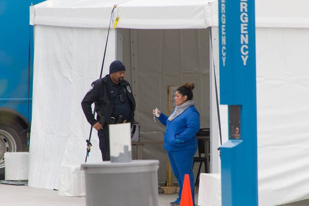 (200320) -- DALLAS (U.S.), March 20, 2020 (Xinhua) -- People work at a drive-thru COVID-19 testing site in Dallas, Texas, the United States, on March 20, 2020. The number of COVID-19 cases in the United States has topped 18,563 as of 18:30 Eastern Standard Time Friday, with 227 deaths, according to the Center for Systems Science and Engineering at Johns Hopkins University. (Photo by Dan Tian Xinhua) U.S.-TEXAS-DALLAS-DRIVE-THRU COVID-19 TESTING SITE 