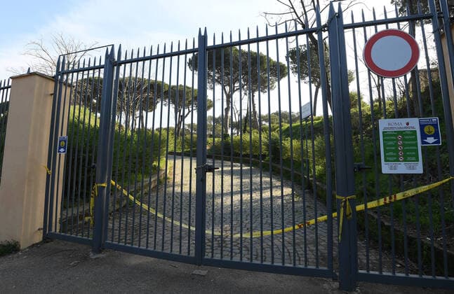 (200321) -- ROME, March 21, 2020 (Xinhua) -- One of the entrances of Villa Phamphili is closed in Rome, Italy, March 20, 2020. Italy s Ministry of Health on Friday took the unprecedented step of closing all public parks, gardens and other open spaces, effective from Saturday. The coronavirus pandemic has claimed 4,032 lives in locked down Italy by Friday, with the number of cumulative cases reaching 47,021, according to new data released by the Civil Protection Department. (Photo by Alberto Lingria Xinhua) ITALY-COVID-19-LOCKDOWN