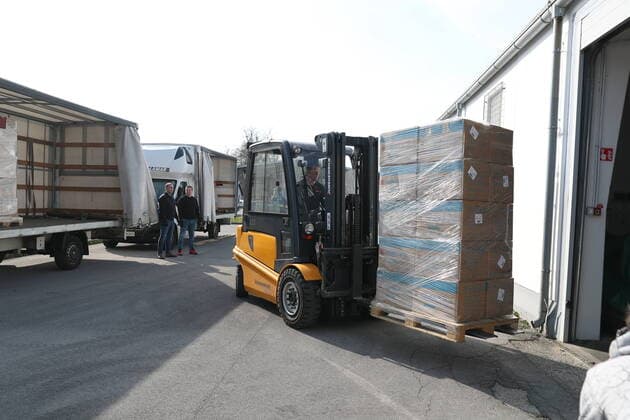 (200321) -- LJUBLJANA, March 21, 2020 -- Workers unload the medical masks from China in Ljubljana, Slovenia on March 20, 2020. A batch of 300,000 medical masks from China arrived in Ljubljana via Belgium on Friday to help the country combat the COVID-19. At the central warehouse, Slovenian administration for civil protection received the masks which are donated by Jack Ma Foundation and the Alibaba Foundation. ) SLOVENIA-LJUBLJANA-COVID-19-CHINA-DONATED MASKS-ARRIVAL PengxLijun 
