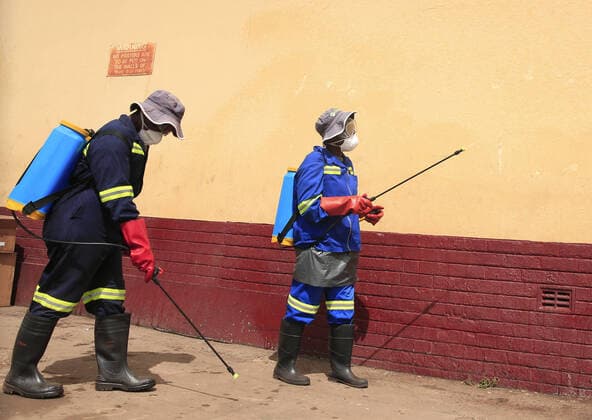 (200321) -- HARARE, March 21, 2020 (Xinhua) -- Health workers disinfect a public bus terminus in Harare, Zimbabwe, March 20, 2020. Zimbabwe on Friday reported its first confirmed case of COVID-19 after a male from Victoria Falls, who had traveled to the United Kingdom, was tested positive. (Photo by Shaun Jusa Xinhua) ZIMBABWE-HARARE-CORONAVIRUS-FIRST CASE 