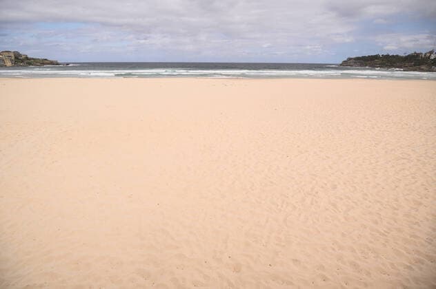 BONDI BEACH CORONAVIRUS CLOSURE, An empty Bondi Beach after it was closed this afternoon in Sydney, Saturday, March 21, 2020. Beachgoers drew condemnation yesterday when tens of thousands of people flouted social distancing rules, which have been put in place in an effort to limit the spread of COVID-19. ( NO ARCHIVING, EDITORIAL USE ONLY, NO USE IN BOOKS WITHOUT CONSENT SYDNEY NSW AUSTRALIA  Copyright: xJAMESxGOURLEYx 20200321001458559056