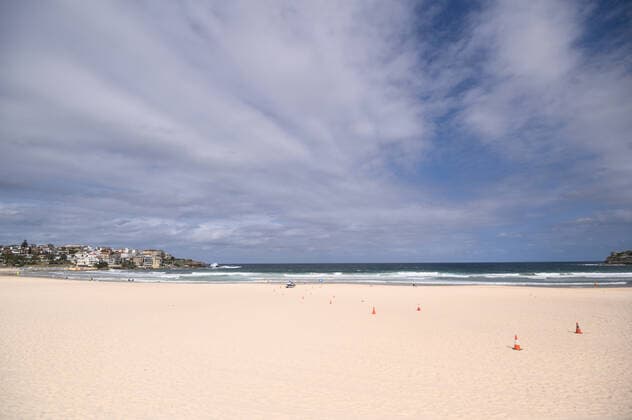 BONDI BEACH CORONAVIRUS CLOSURE, An empty Bondi Beach after it was closed this afternoon in Sydney, Saturday, March 21, 2020. Beachgoers drew condemnation yesterday when tens of thousands of people flouted social distancing rules, which have been put in place in an effort to limit the spread of COVID-19. ( NO ARCHIVING, EDITORIAL USE ONLY, NO USE IN BOOKS WITHOUT CONSENT SYDNEY NSW AUSTRALIA  Copyright: xJAMESxGOURLEYx 20200321001458559321