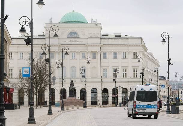 (200321) -- WARSAW, March 21, 2020 (Xinhua) -- A police van patrols on a street in Warsaw, Poland, March 20, 2020. Polish Prime Minister Mateusz Morawiecki said on Friday that Poland has introduced a state of epidemic emergency to curb the spread of the novel coronavirus. The prime minister also announced the introduction of tougher penalties for breaking quarantine rules and affecting location-tracking of people under quarantine. The number of Poland s confirmed coronavirus cases has risen to 425 and five people died from the COVID-19, the Polish Health Ministry announced on Friday evening. (Xinhua Zhou Nan) POLAND-WARSAW-COVID-19 