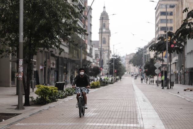 (200321) -- BOGOTA, March 21, 2020 (Xinhua) -- A man rides on a street in Bogota, Colombia, March 20, 2020. The Colombian capital of Bogota began on Friday the mandatory isolation drill decreed by mayor Claudia Lopez in order to prepare for a quarantine aimed at containing the COVID-19 pandemic. The mandatory isolation drill in the Colombian capital, home to more than seven million people and where 56 of Colombia s 145 cases of COVID-19 have been confirmed, will remain in effect until midnight on March 23. (Photo by Jhon Paz Xinhua) COLOMBIA-BOGOTA-MANDATORY ISOLATION 
