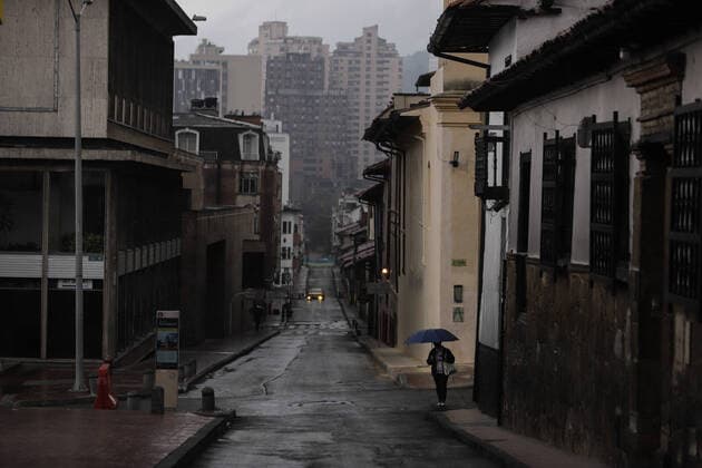 (200321) -- BOGOTA, March 21, 2020 (Xinhua) -- A citizen walks on a street in Bogota, Colombia, March 20, 2020. The Colombian capital of Bogota began on Friday the mandatory isolation drill decreed by mayor Claudia Lopez in order to prepare for a quarantine aimed at containing the COVID-19 pandemic. The mandatory isolation drill in the Colombian capital, home to more than seven million people and where 56 of Colombia s 145 cases of COVID-19 have been confirmed, will remain in effect until midnight on March 23. (Photo by Jhon Paz Xinhua) COLOMBIA-BOGOTA-MANDATORY ISOLATION 